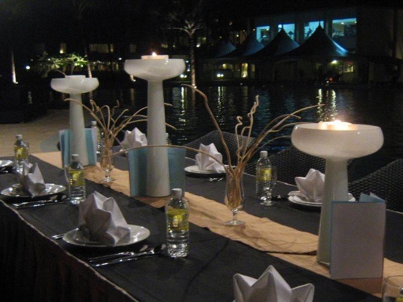 Damai Puri Resort & Spa Кучинг Экстерьер фото A table set for a formal dinner