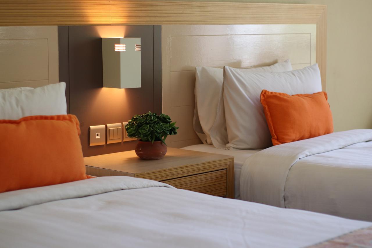 Damai Puri Resort & Spa Кучинг Экстерьер фото A room at the hotel